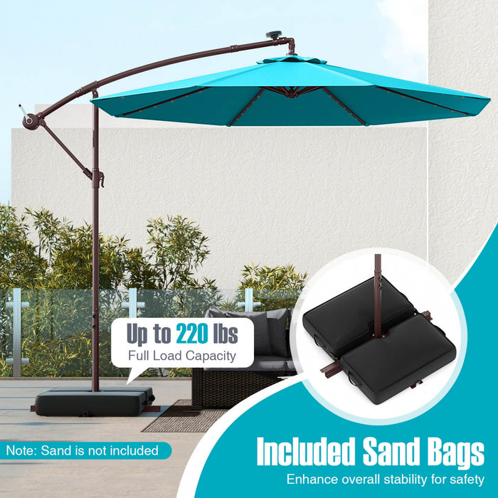 Parasol deporte suspendu Costway 10 pieds avec 32 LED, sac de sable, base croisee exterieure turquoise