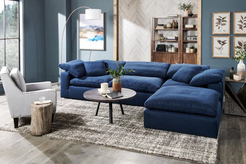 Sofa sectionnel modulaire Eclipse 4 pièces en tissu d’apparence lin avec pouf et coussins réversibles en duvet et plumes - bleu marine
